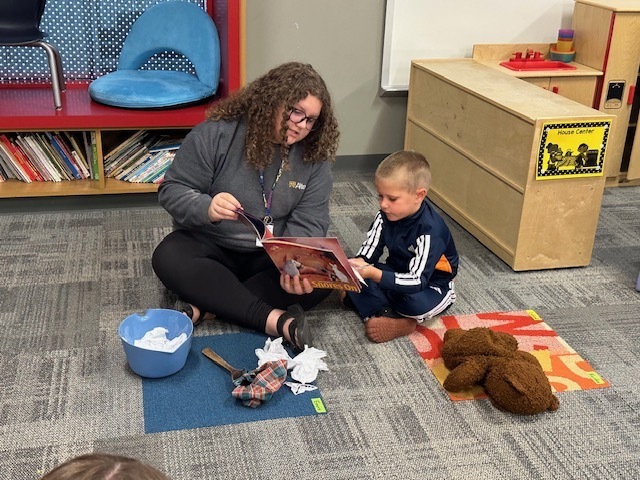 ECP Student reading to CELC Students.