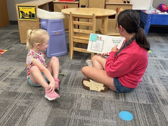 ECP Student reading to CELC Students.