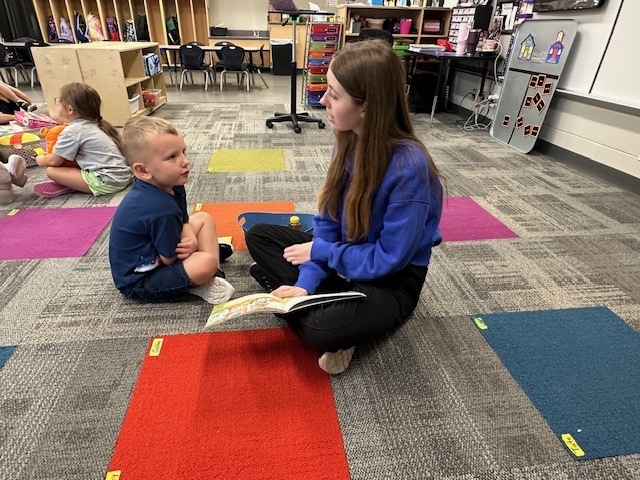 ECP Student reading to CELC Students.