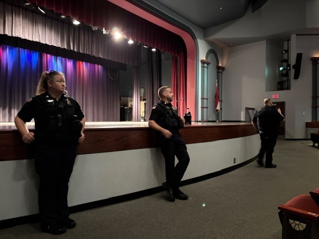 SROs Plummer, Clark and Hogan in the Performing Arts Center with Chillicothe R-II Staff following the intrudor drill at CES for debriefing
