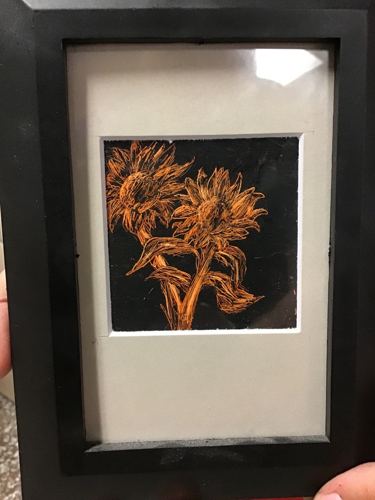 Teagan Reeder's Scratch Art. Two sunflowers.