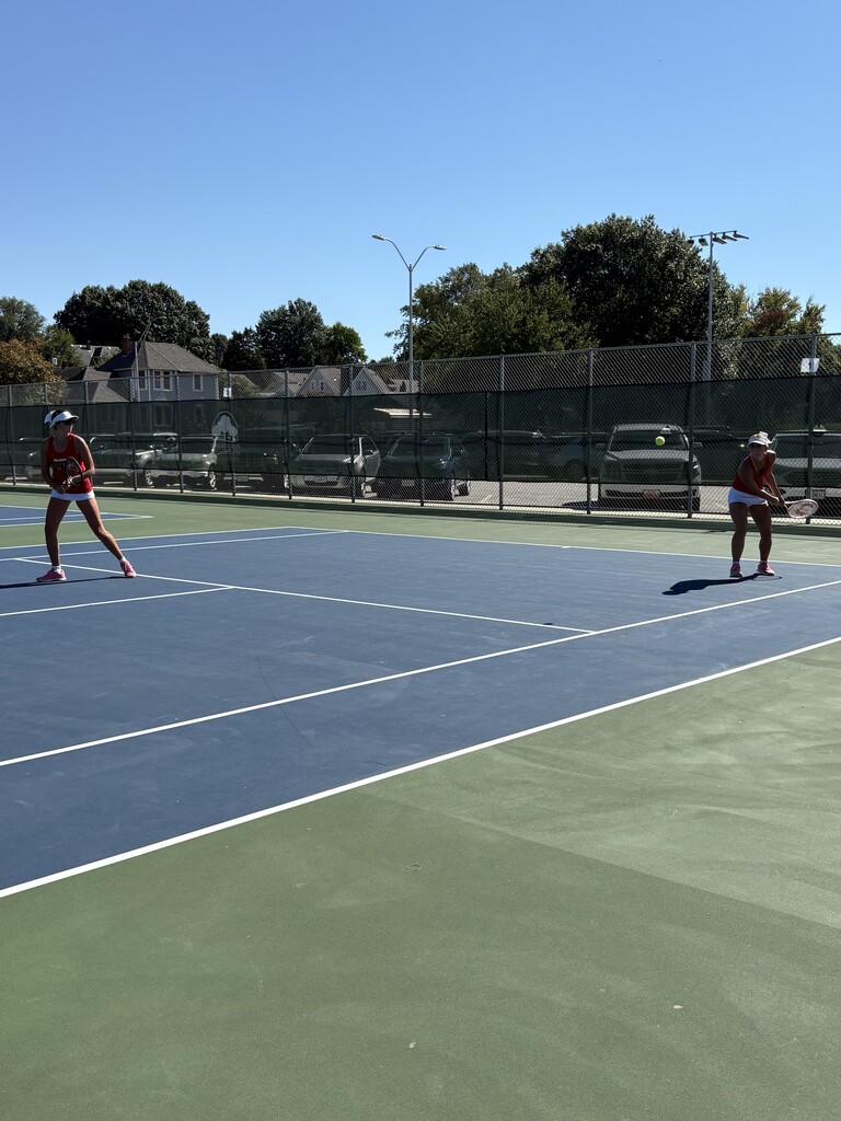 Lexy Smith and Lydia Bonderer playing tennis doubles at the District Tournament this morning.