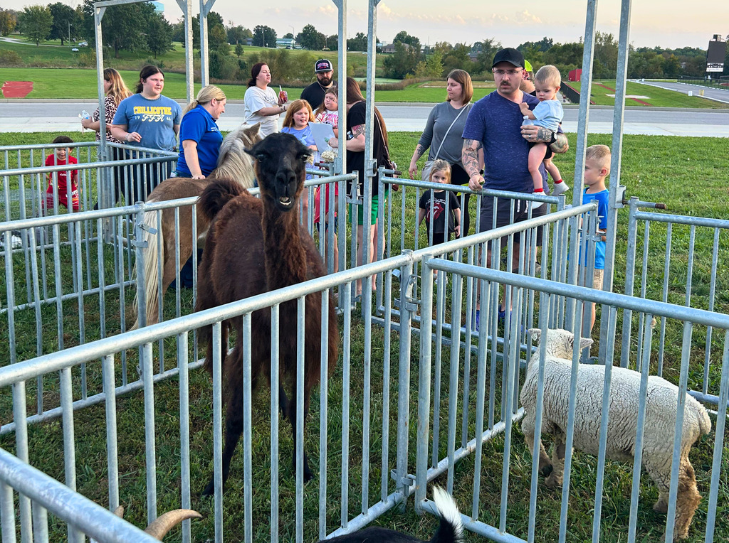 Parents and children look at a petting zoo at the CES Fall Fun Night held last night.