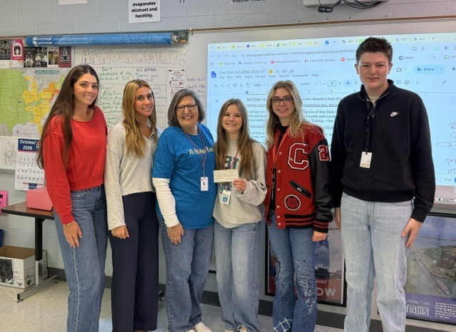 Julie Barnes is picturd with several CHS Key Clubb students.