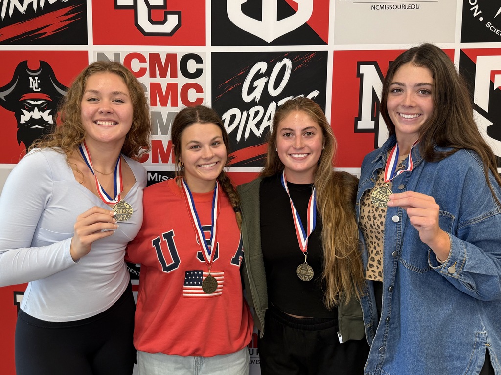 Abby marshall, Dawson Baker, Lexi Lybarger and Lydia Bonderer holding medals after the Egineering Competition (Tallest Standing Tower Built)