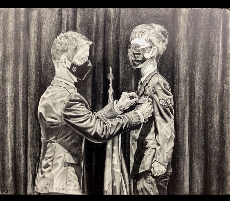 Kierra Williams' Artwork that is heading to state. A drawing of a soldier receiving a medal. 
