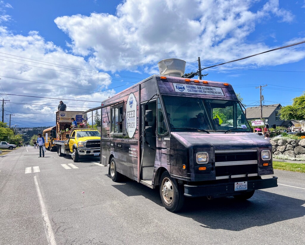 Chimacum student Feed Truck riding in the Rhody Parade.