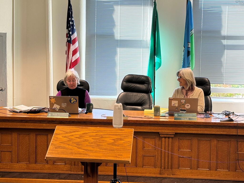 Two Jefferson County Commissioners seated in the chambers during the proclamation.