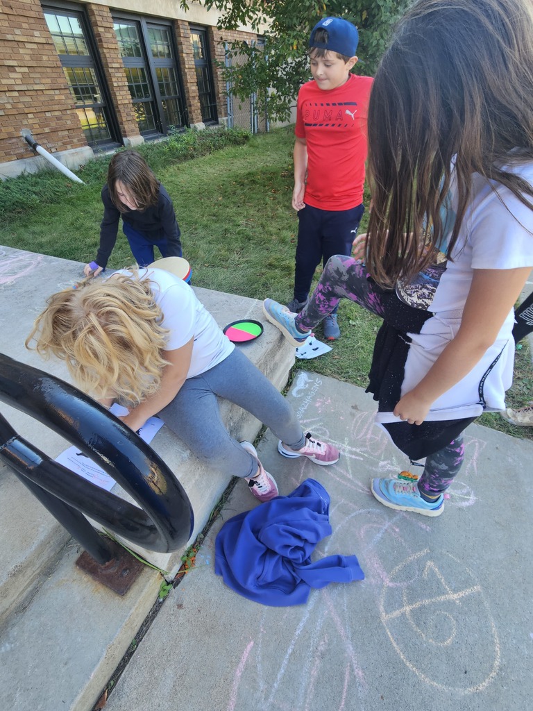Students participating in an Ojibwe scavenger hunt during lunch recess.