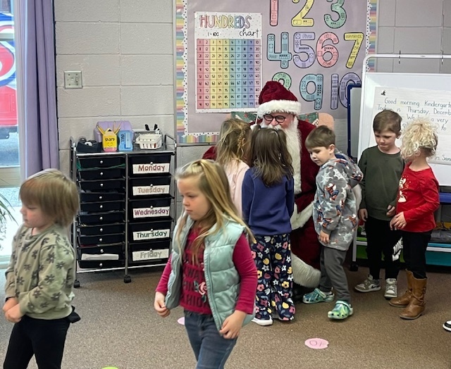Santa visits our Pre K and Kg Students and teachers.