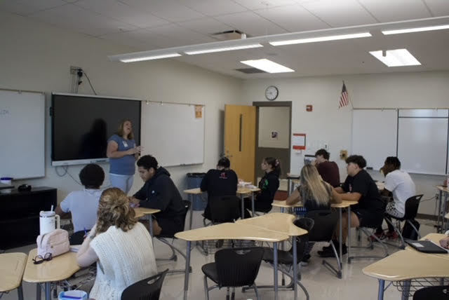 Katie Logan Hedges speaks to students