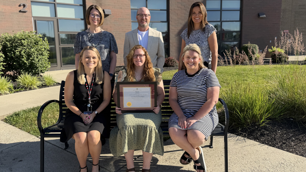 group photo of our treasurers department staff members holding auditors award