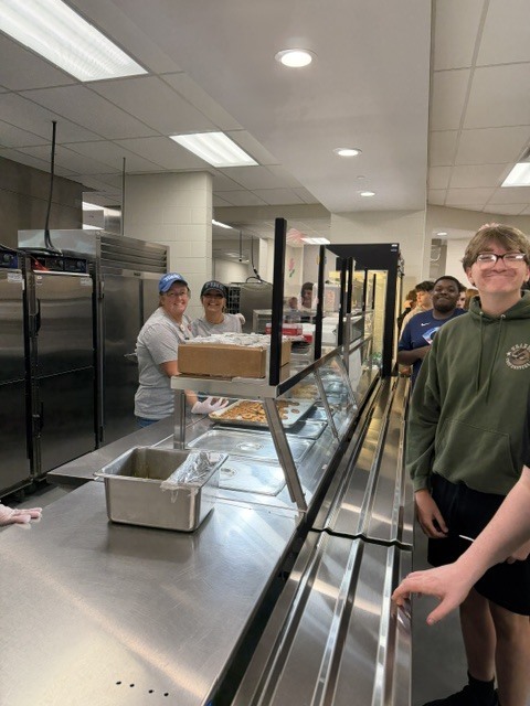 food service staff serving lunch
