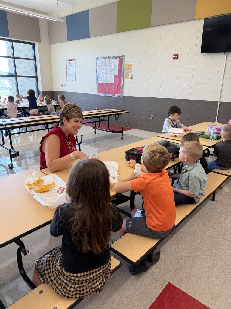 dr halley chats with some kindergartners at lunch
