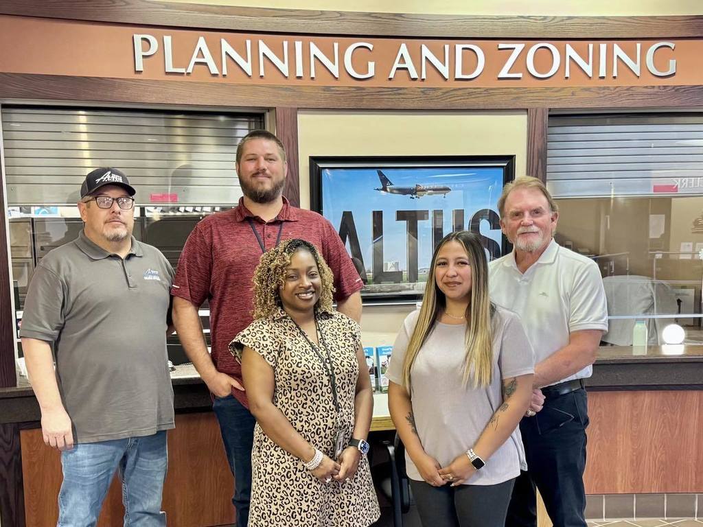 Five members of the City of Altus Code Enforcement and Planning team standing together in front of a “Planning and Zoning” sign. Pictured from left to right: Chase Clemmons, Meka Cathey, Mia Fernandez, Kevin Jones, and Terry Mosley. Gregory Fisher, also part of the team, is not pictured.