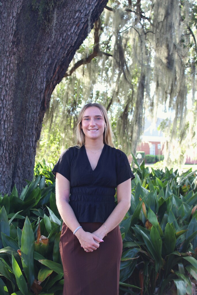 Raylee Bell Dean pictured in front of John the Baptist oak tree