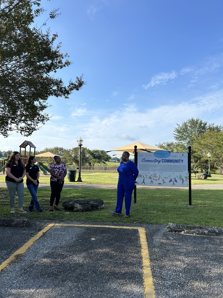 Mayor Sylvia Washington addresses group at Andrews Street Park Councilperson Marquita Harris and two representatives from Bank OZK pictured beside Mayor Washington