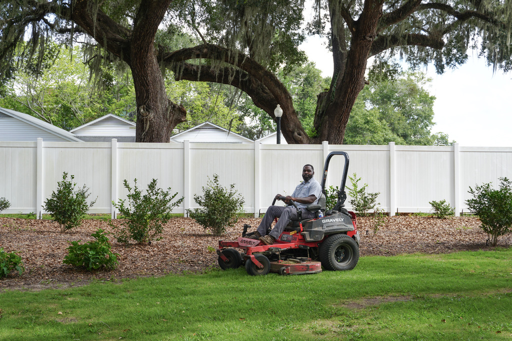 City of Bainbridge Parks Department employee mowing grass at Chason Park