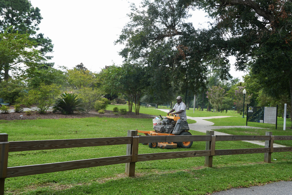 City of Bainbridge Parks department employee mowing at Earle May Recreation Area