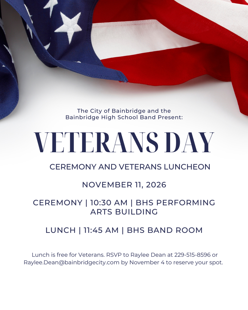 Veterans Day Ceremony and Luncheon invitation featuring a draped American flag. The City of Bainbridge and Bainbridge High School Band will host a Veterans Day ceremony on November 11, 2026, at 10:30 AM in the BHS Performing Arts Building. A complimentary luncheon for veterans will follow at 11:45 AM in the BHS Band Room. Veterans must RSVP by November 4 to Raylee Dean at 229-515-8596 or Raylee.Dean@bainbridgecity.com.