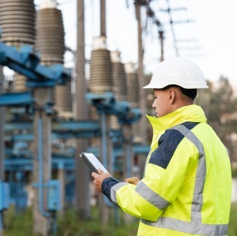 electric worker with clipboard