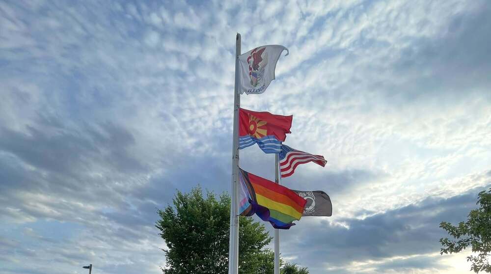 Flag pole with state, city, pow, us, and unity flags