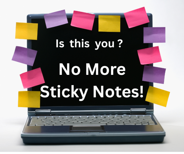 computer with sticky notes around the screen