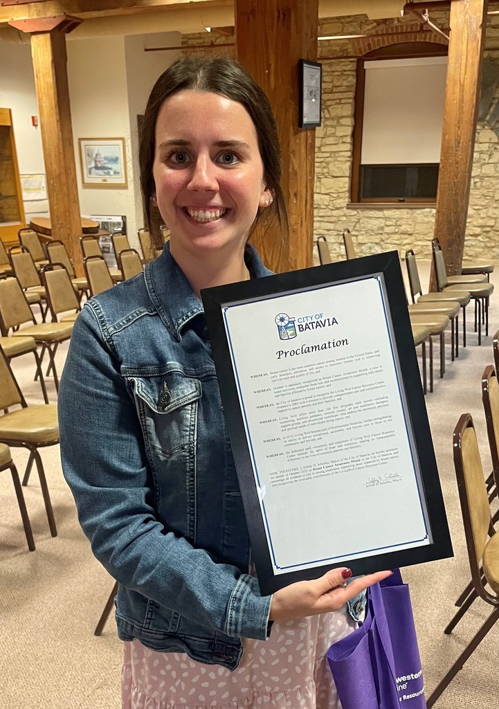 Erin O'Malley holding a proclamation