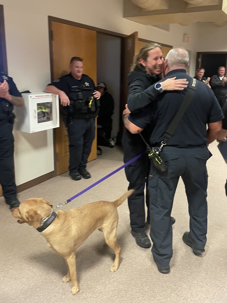 Officer Webb congratulates her father, Paramedic Webb