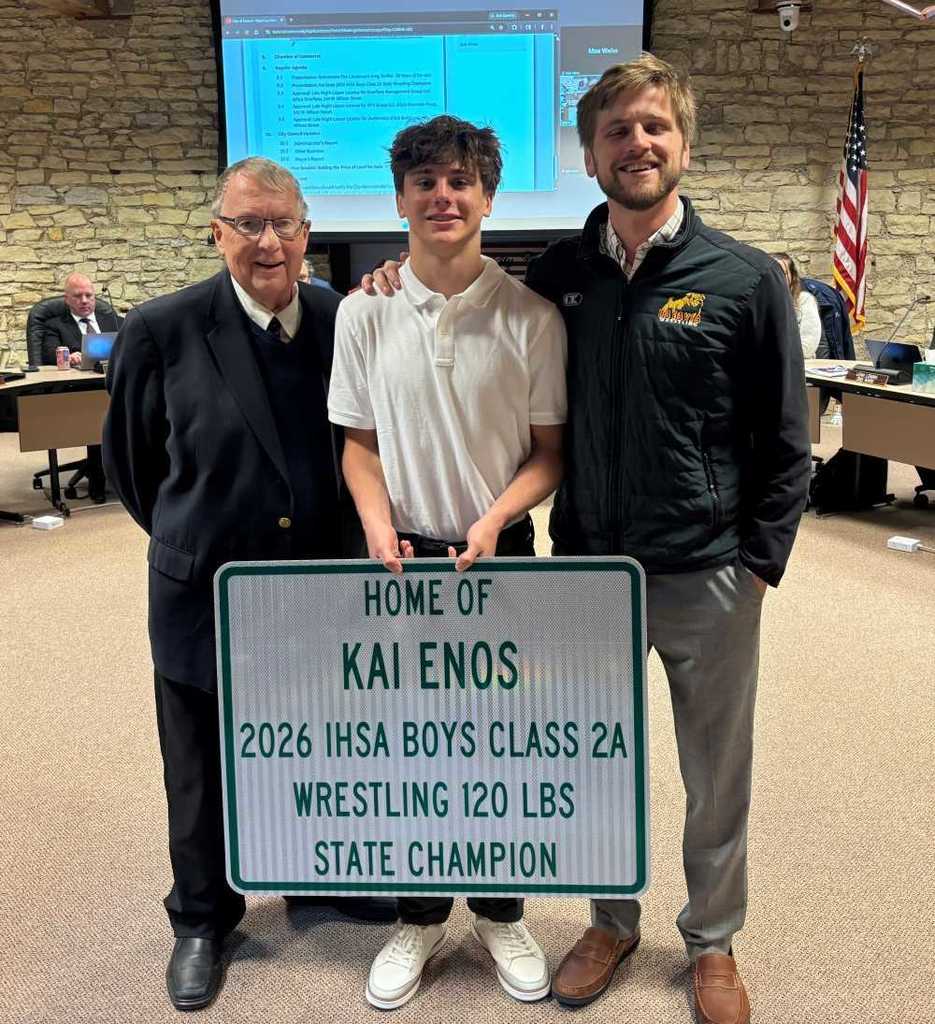 Mayor Jeff Schielke, Kai Enos and Batavia High School Wrestling Coach Seth Winkle