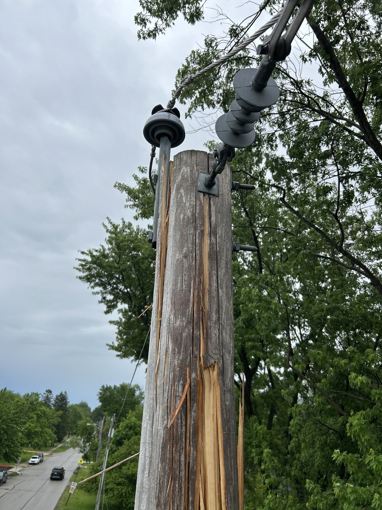 Electric pole split by lightning; temporarily fixed