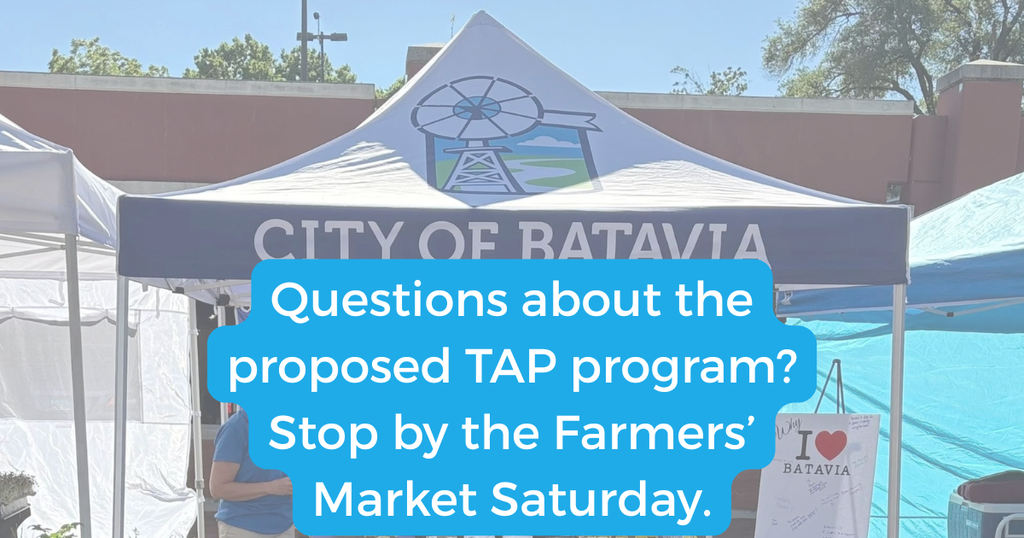 City of Batavia tent at the farmer's market with "Questions about the proposed TAP program? Stop by the Farmers' Market Saturday