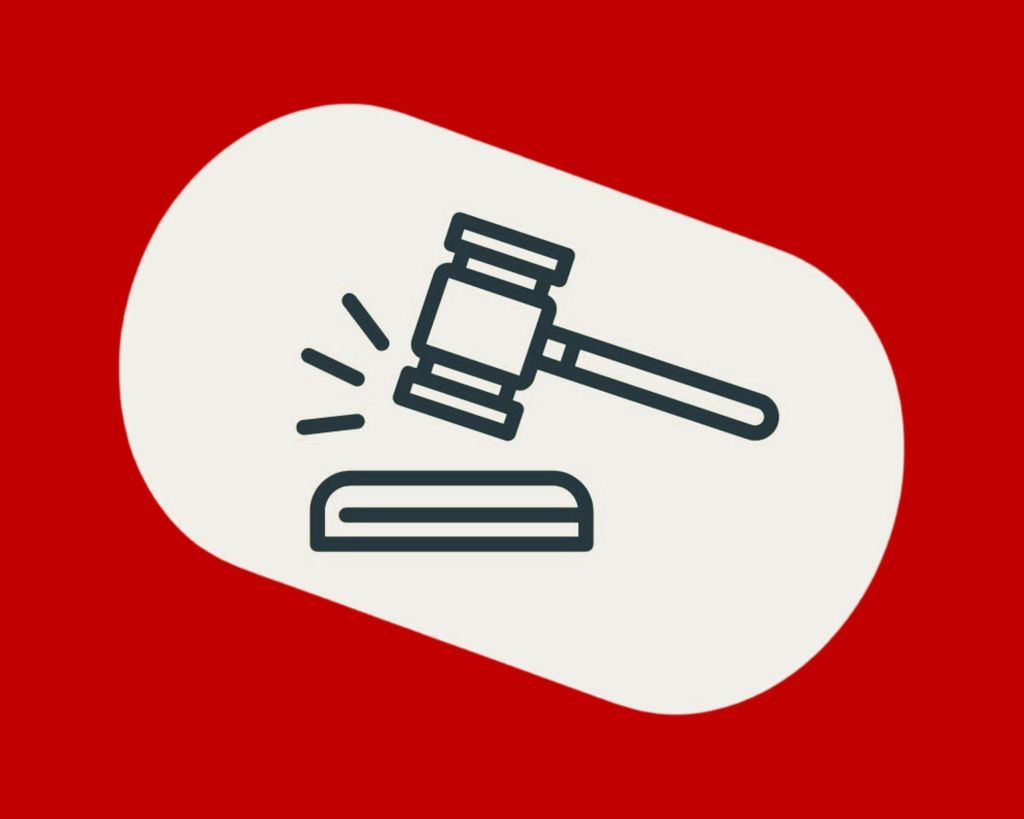 A clipart of a gavel on a red background.