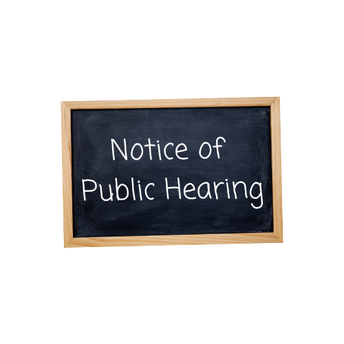 Notice of public hearing written on a chalkboard