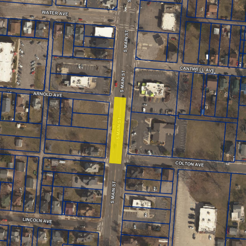 Aerial view of an urban area with buildings and streets. Highlighted section is labeled "Main Street".
