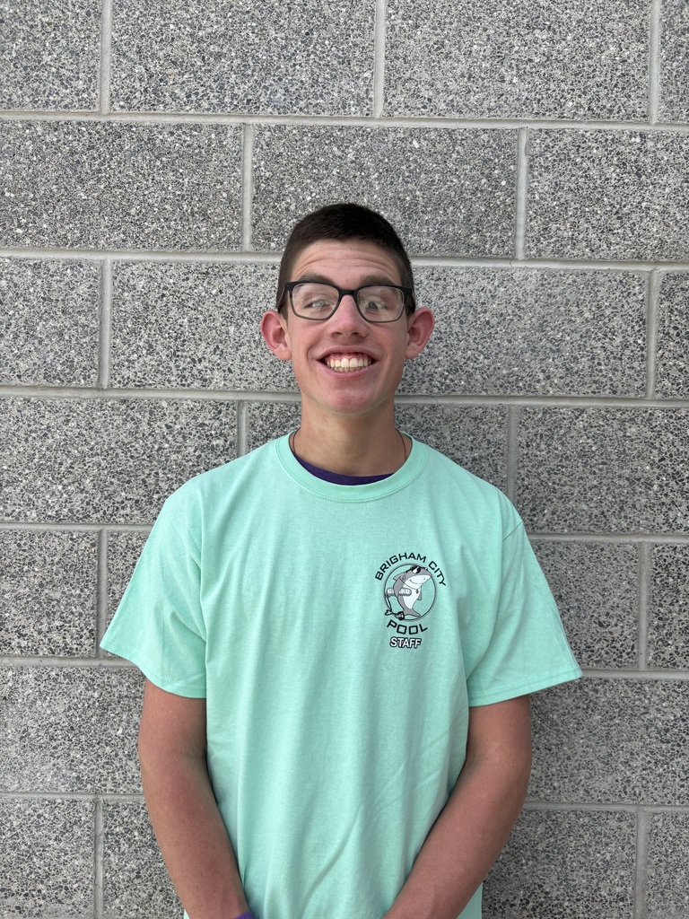 Photo of Davis Lloyd smiling and wearing a light blue shirt.