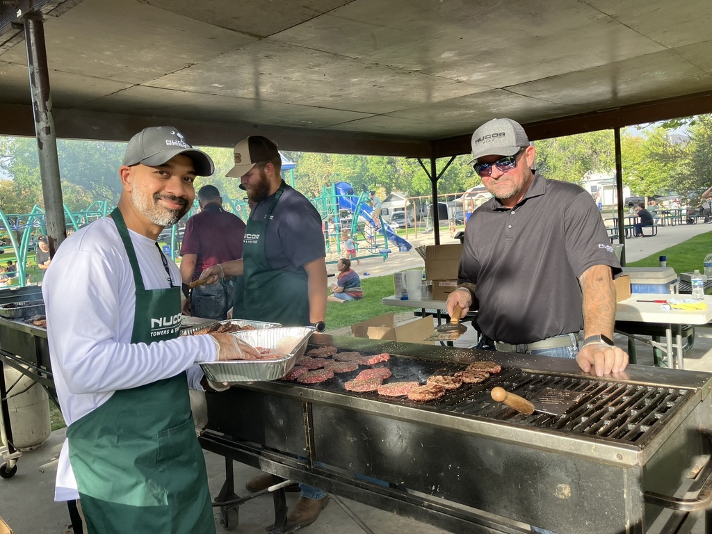 Nucor employees prepare burgers