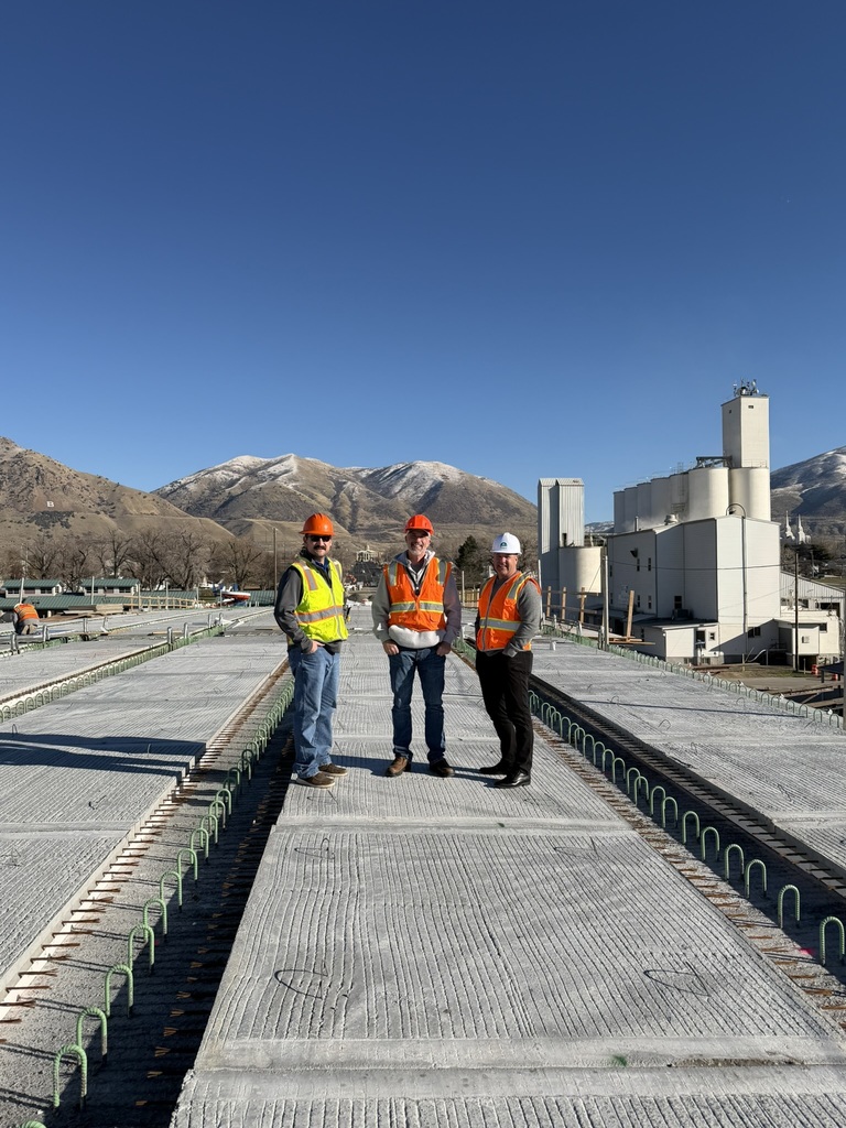 Derek Oyler, Tyler Pugsley, and Mayor DJ Bott stand on the overpass