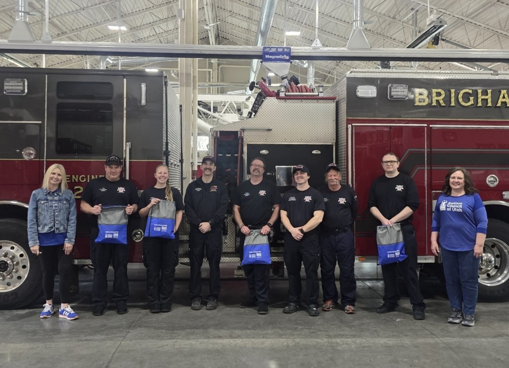 a group from the Autism Council of Utah in front of a Brigham City fire truck