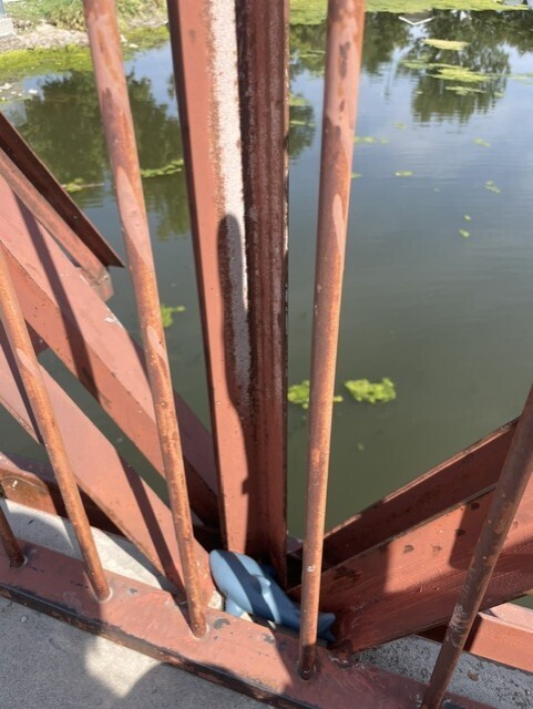 a toy animal among metal bars