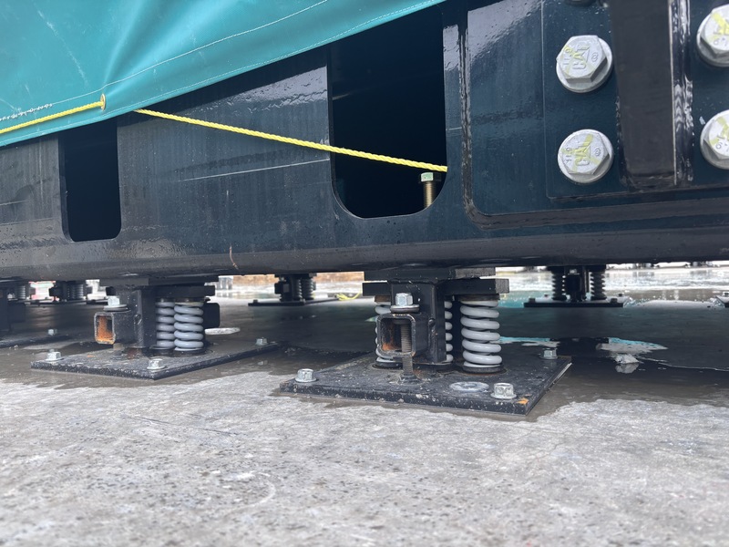 a close-up of the springs the generators sit on