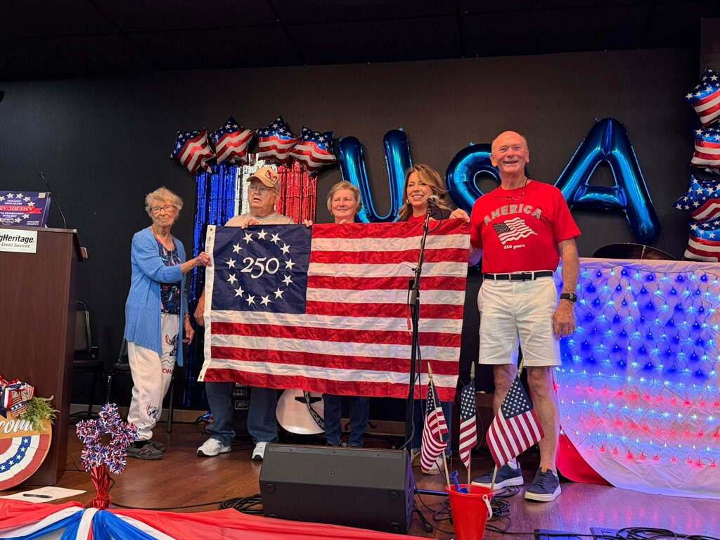 Mayor accepting flag presentation