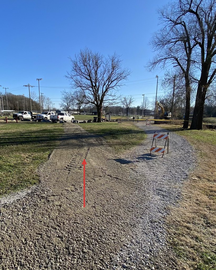 Arrow pointing to open Greenway Trail path