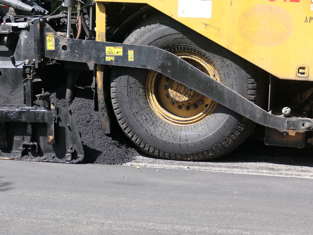 Image of a tire and road being milled.