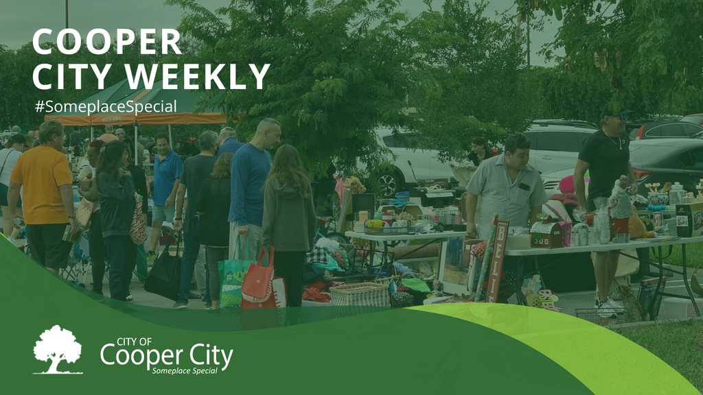 People attending a garage sale with items on tables.