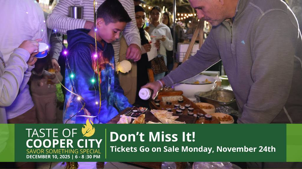 Young boy at a table being served food.