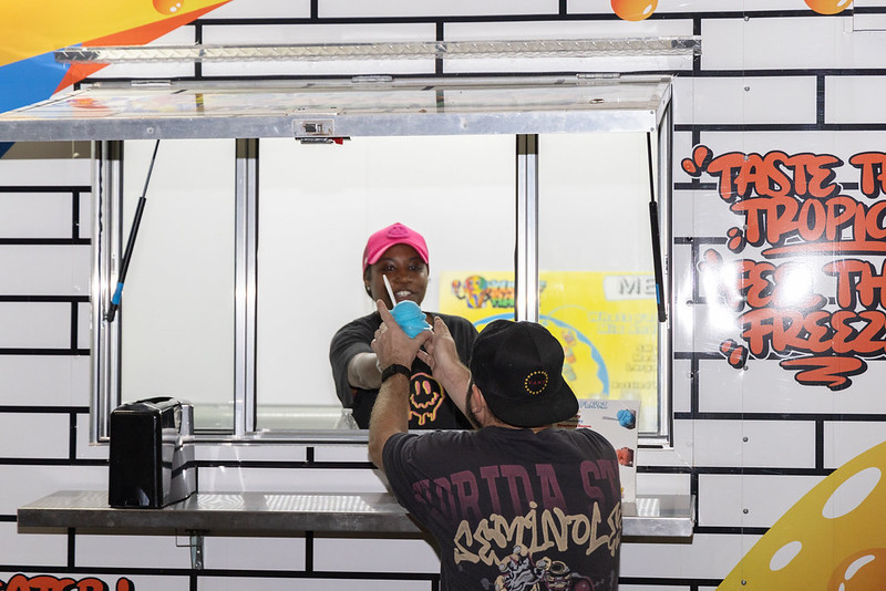 employee handing product to customer