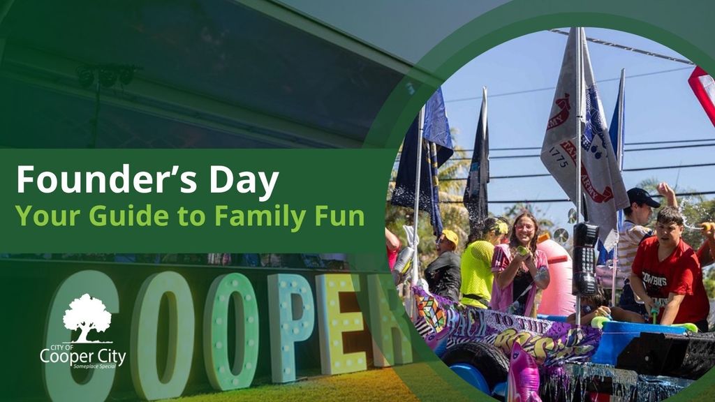 People on a parade float shooting water guns