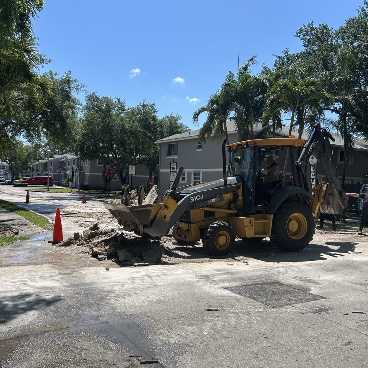 backhoe picking up dirt