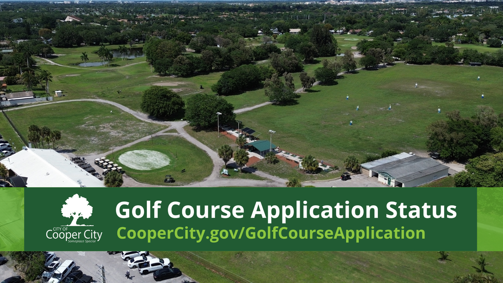 Aerial view of a gold course with a clubhouse also in view